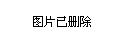 22日晚11時(shí)，有大型鏟車正在清理運(yùn)石車上翻落的石塊。　呂子豪　攝